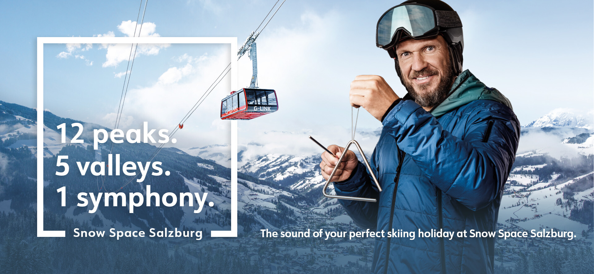 Hermann Maier in ski equipment in front of a gondola of the G-Link aerial tramway from Snow Space Salzburg