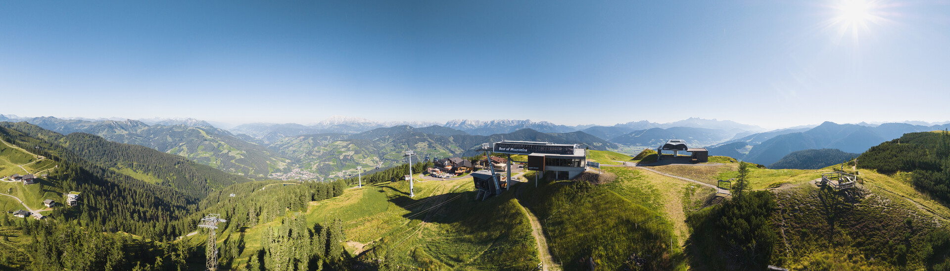 Drone shot of the mountain in snow space Salzburg  A mountain station of the snow space region from drone perspective in summer