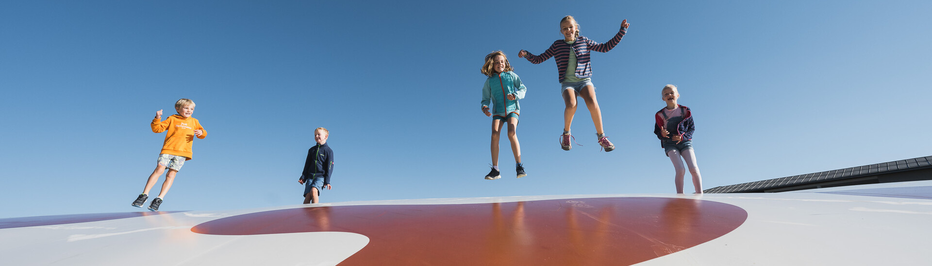 Children playing on the trampoline in Snow Space Salzburg 